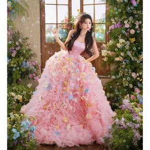 New pink wedding dress theme for couples' indoor photography at the photo studio, featuring a high-end, sweet style with floral strapless design and colorful tulle