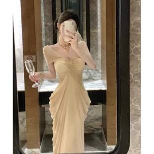Elegant and luxurious evening gown for women, featuring a sheer mesh design, halter neckline, and long sleeves, perfect for a sophisticated seaside vacation