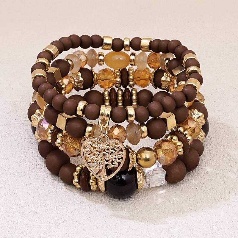 Four-piece set of beaded Bohemian ethnic style multi-layer glass bead bracelets with heart pendants for women, personalized hand accessories wholesale