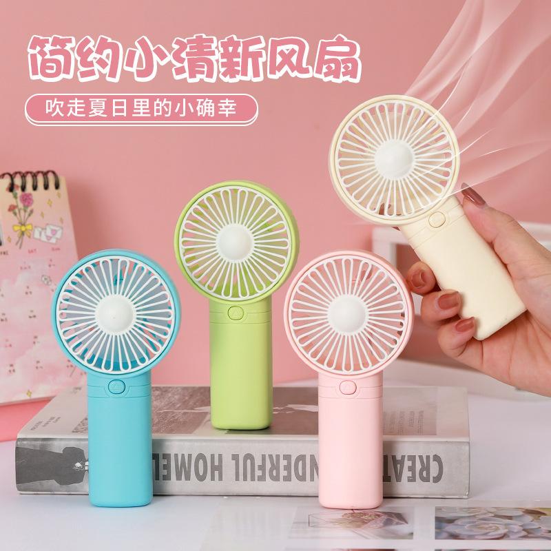 25 new cross-border MiNi fan mini fan handheld small fan dry battery small electric fan logo gift stall