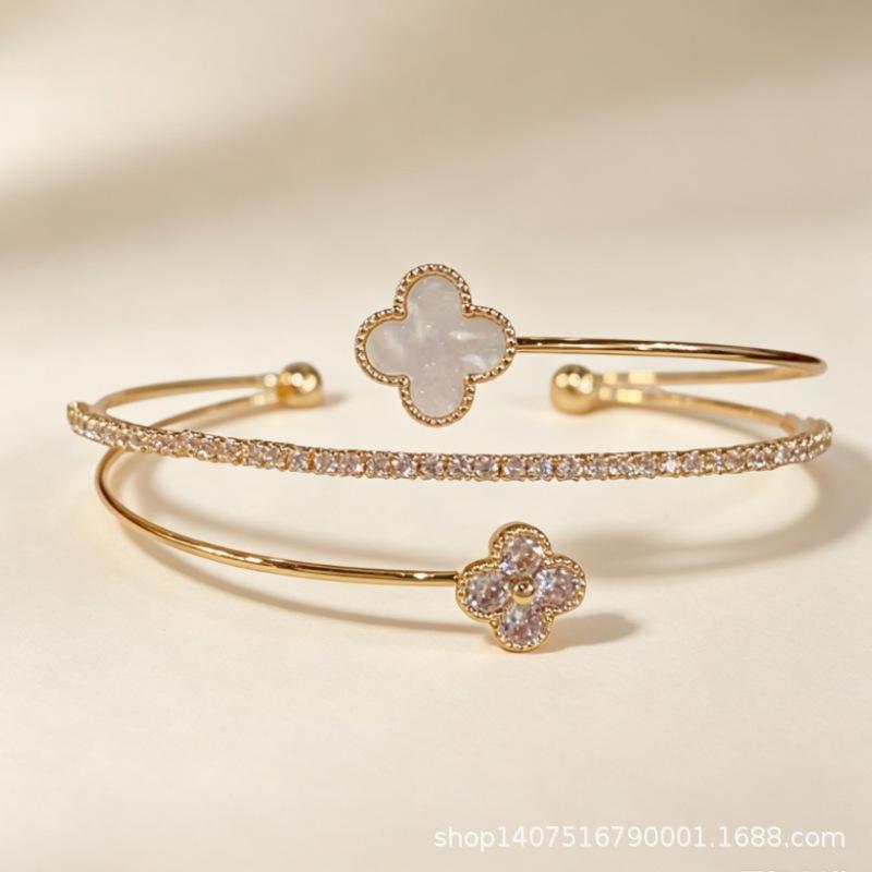 Luxurious copper-inlaid zircon four-leaf clover open bracelet with a high-end, niche design, adjustable fashion wristband for women